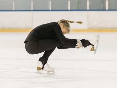 Athlete demonstrating balance on one leg during an exercise.